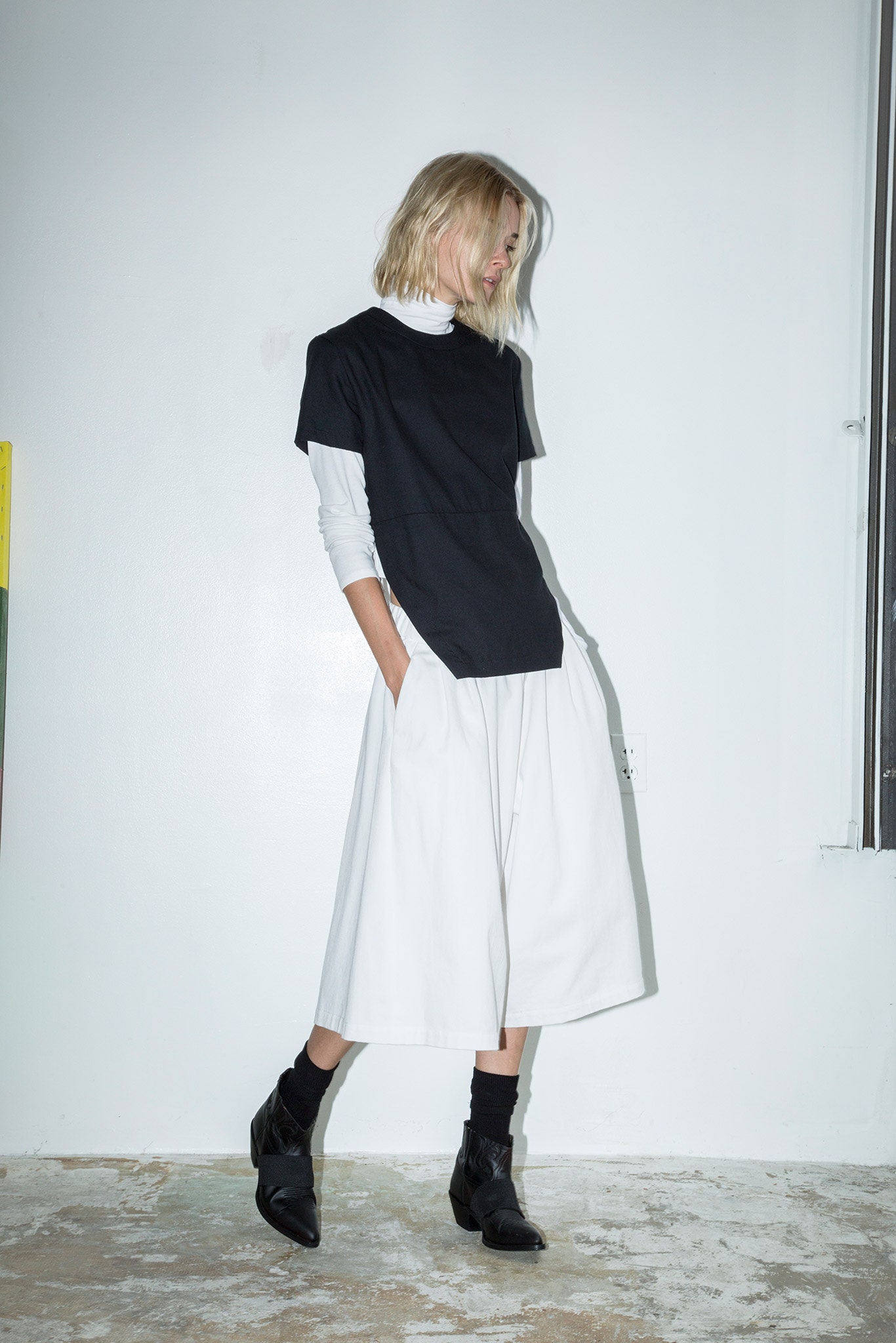 black top white pleated skirt