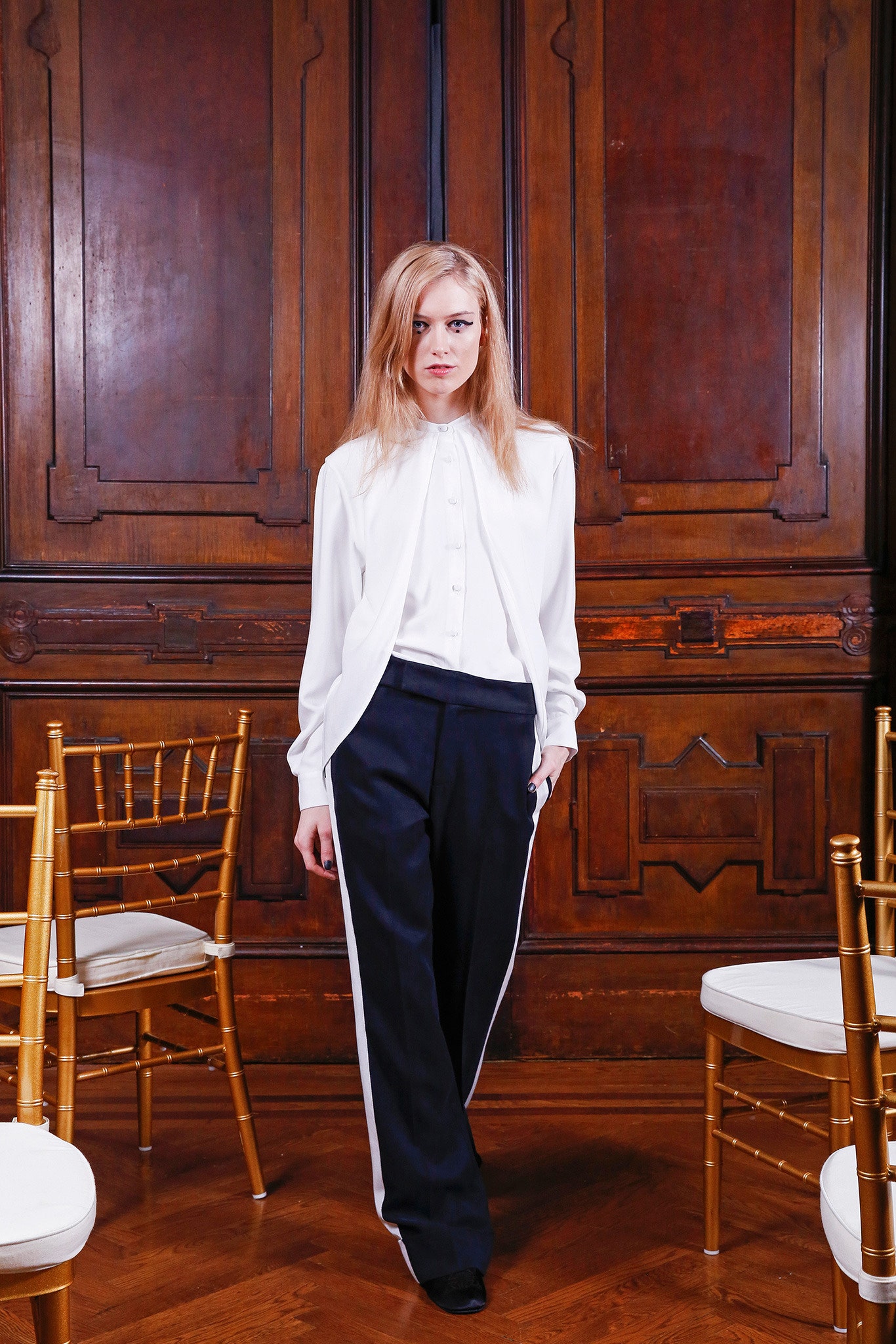 white silk blouse and black tailored pants
