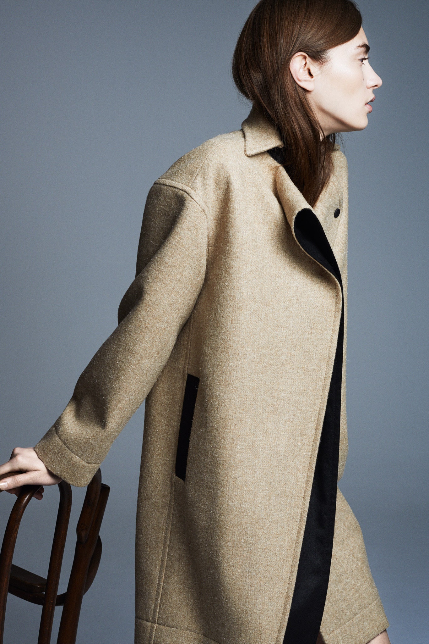 beige wool coat with black dress