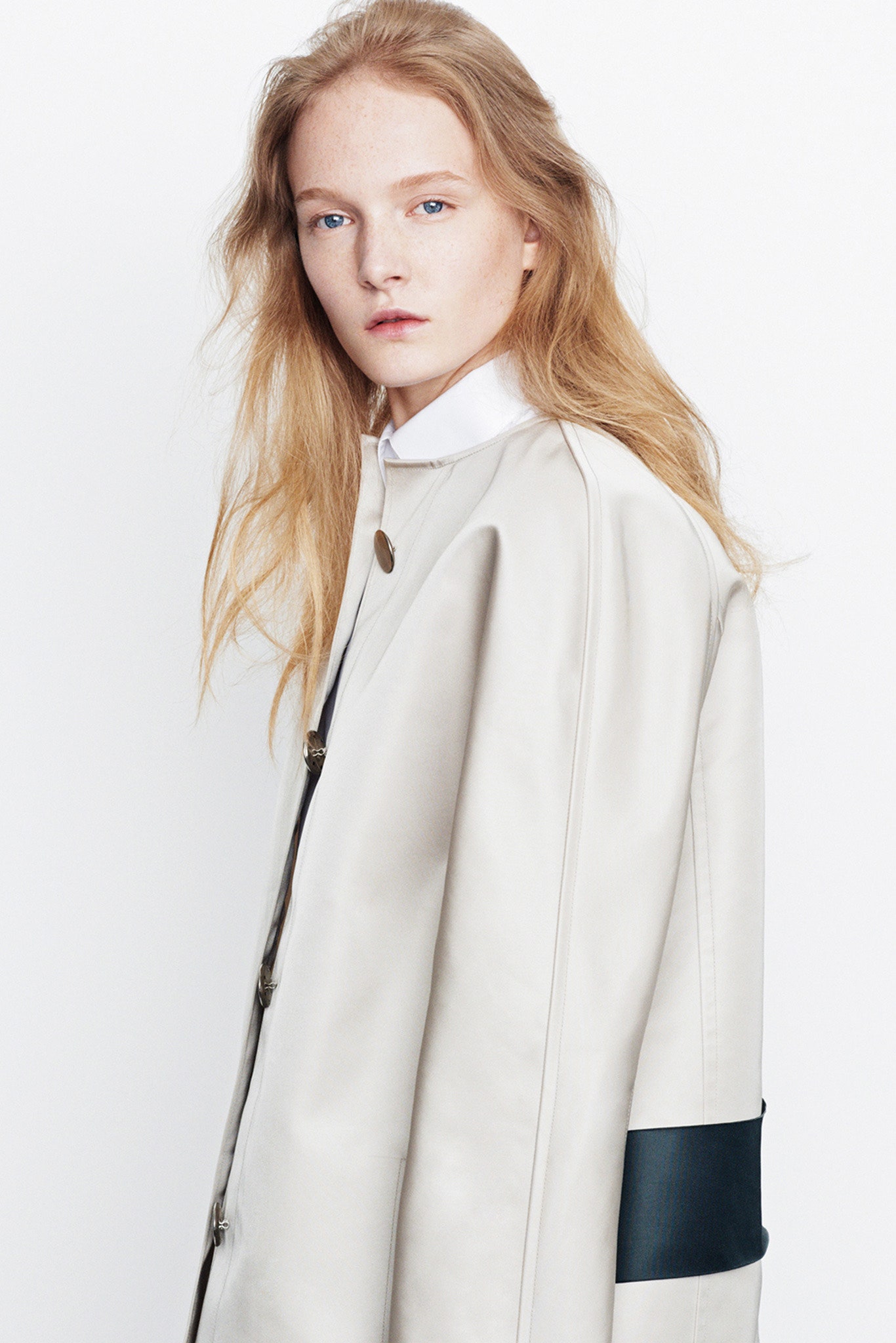beige leather coat and white shirt