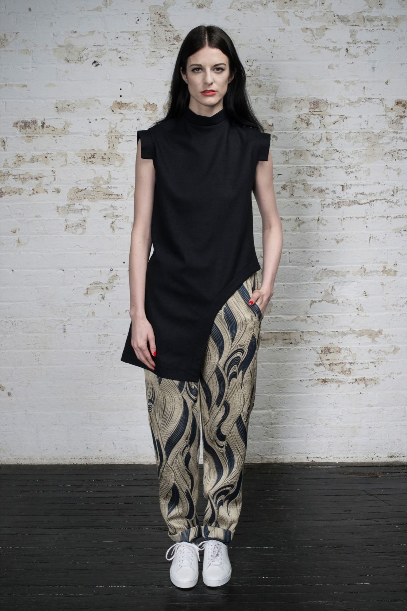 black fitted top with beige printed pants