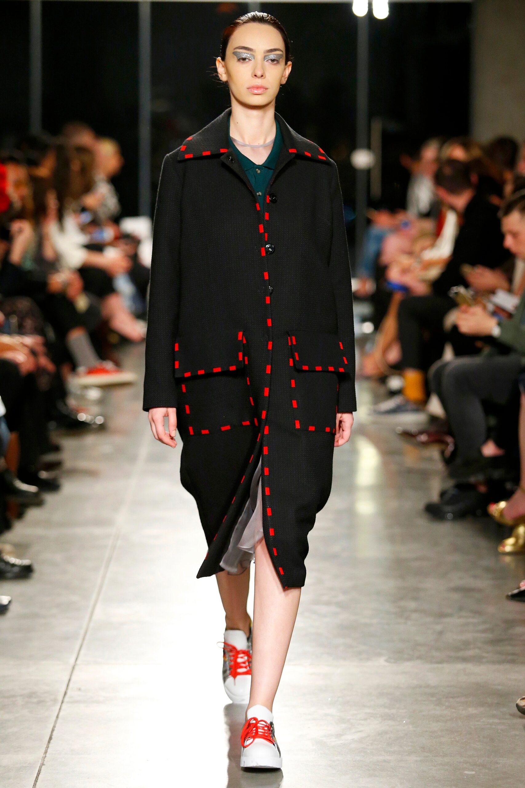 black relaxed coat with red details