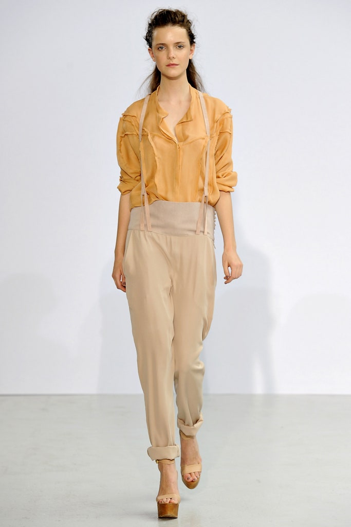 orange silk relaxed shirt with beige pants