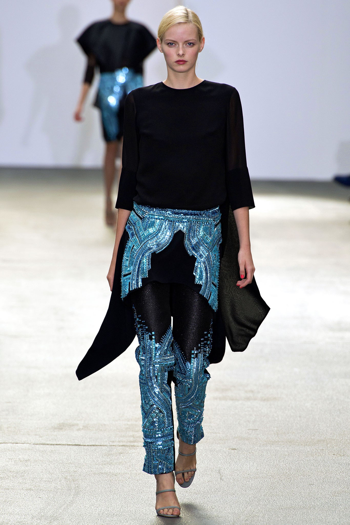 black silk top with embellished pants