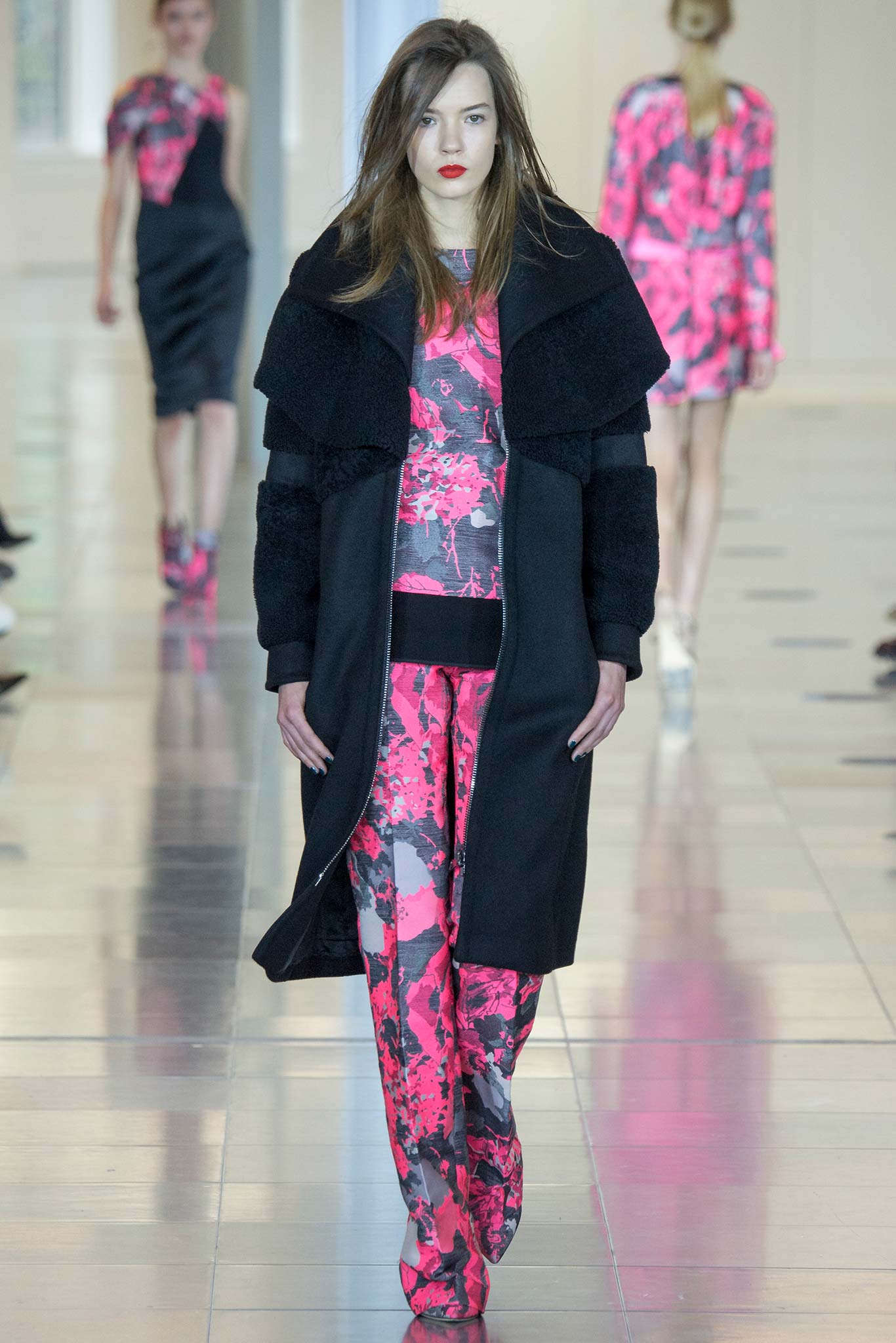 black wool coat with printed top and pants