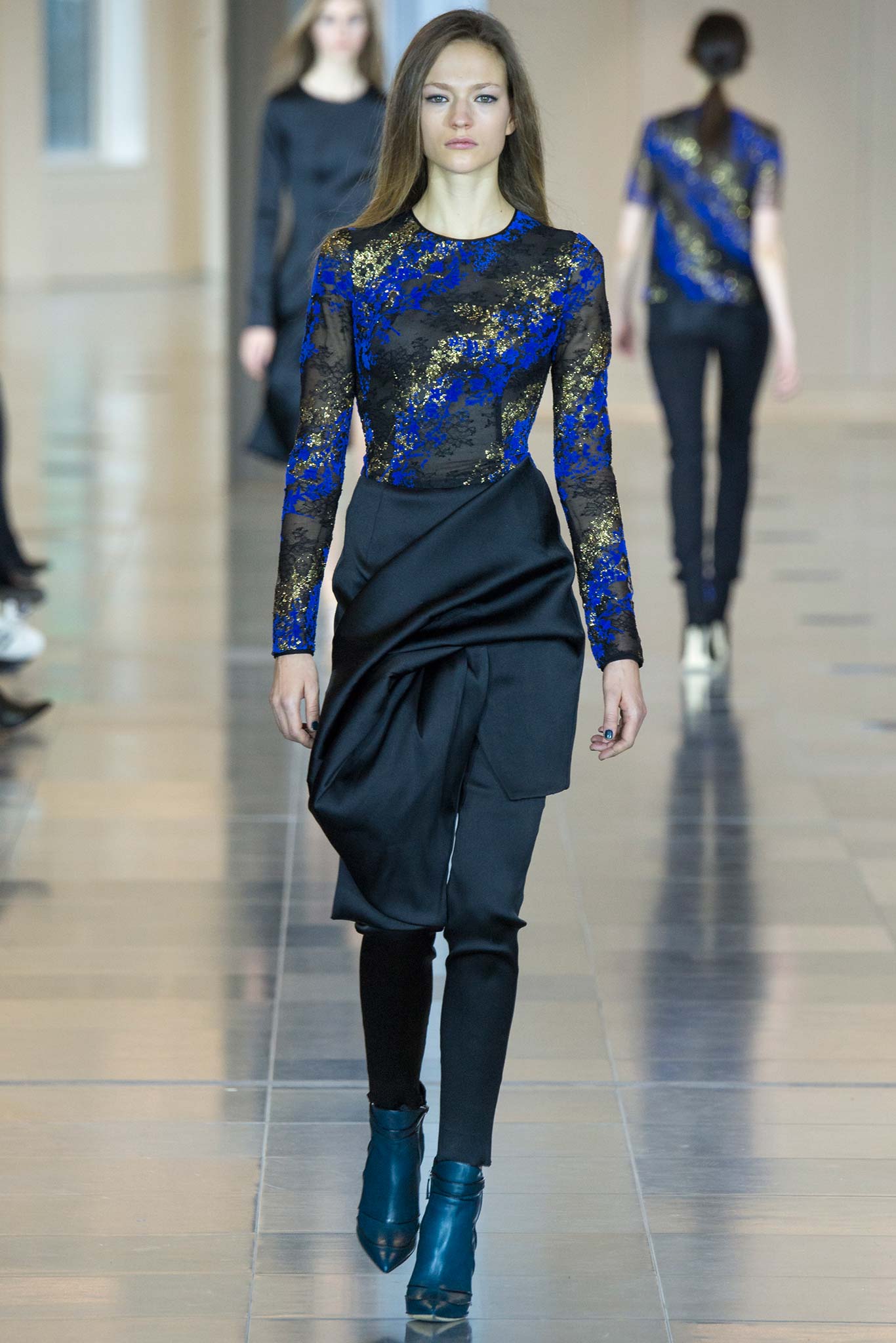fitted blue embroidered top with black pants
