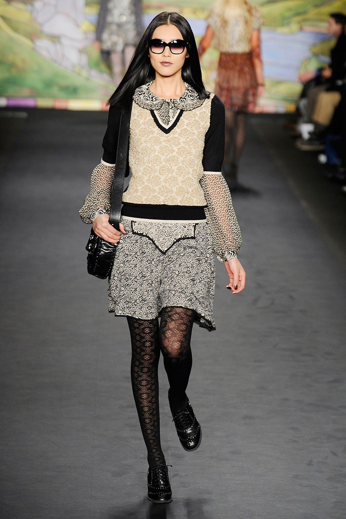 black and beige layered top with mini skirt