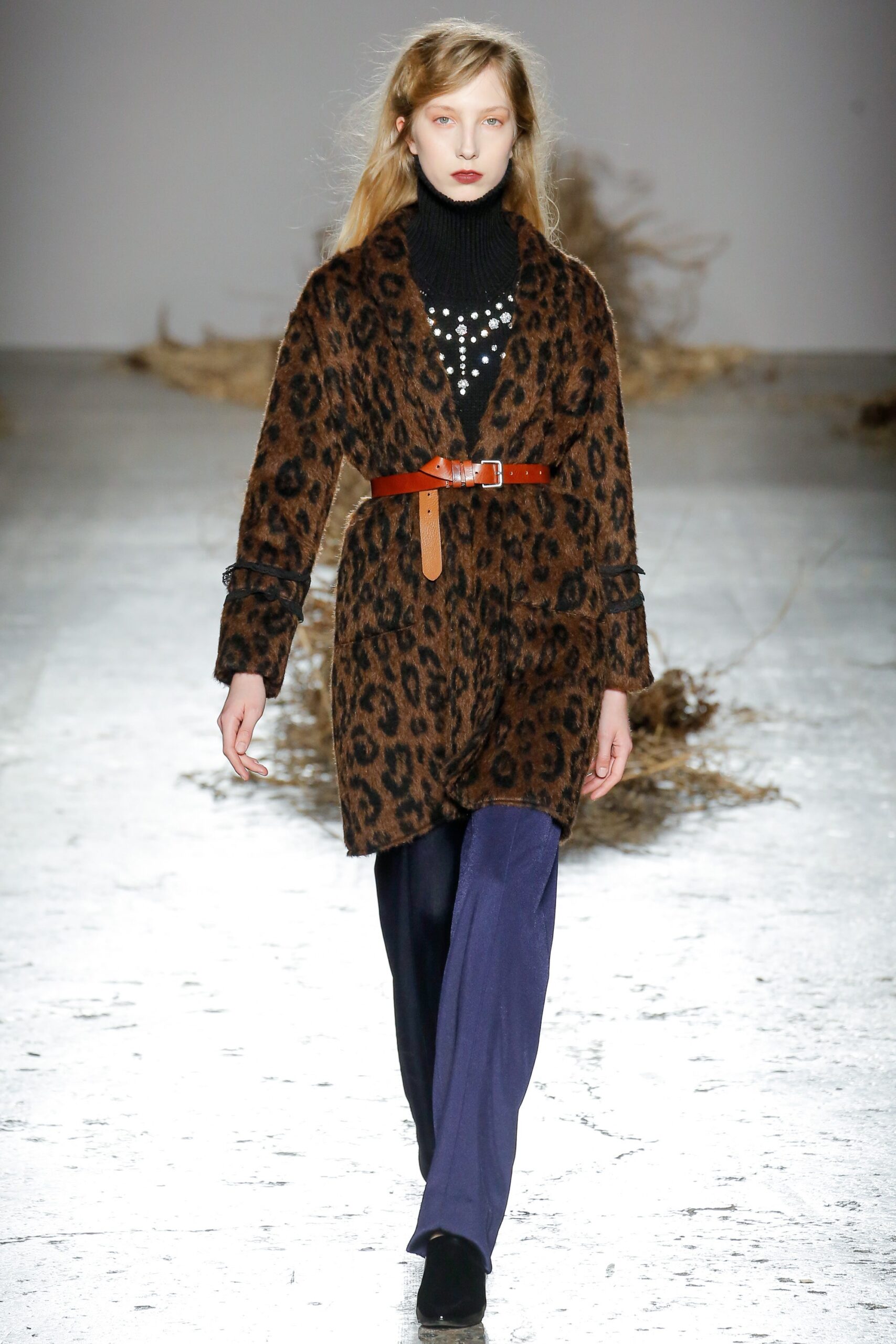brown animal-print coat with black sweater