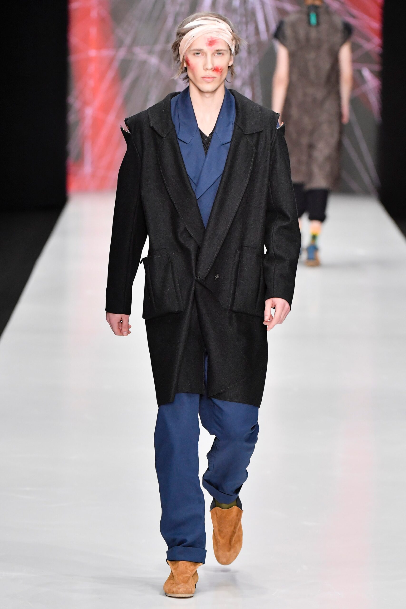 black coat blue jacket and pants