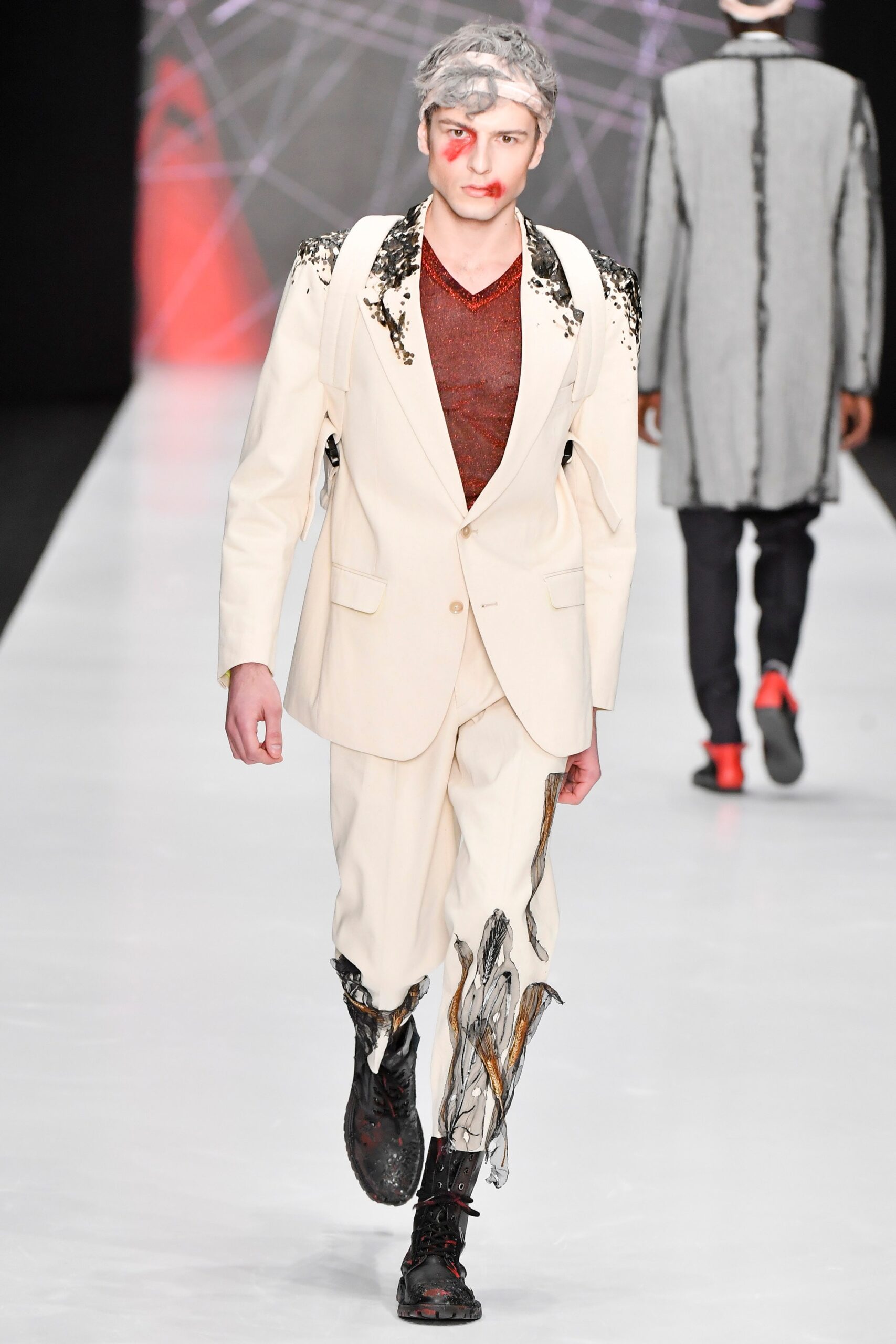 white tailored suit with black shoes