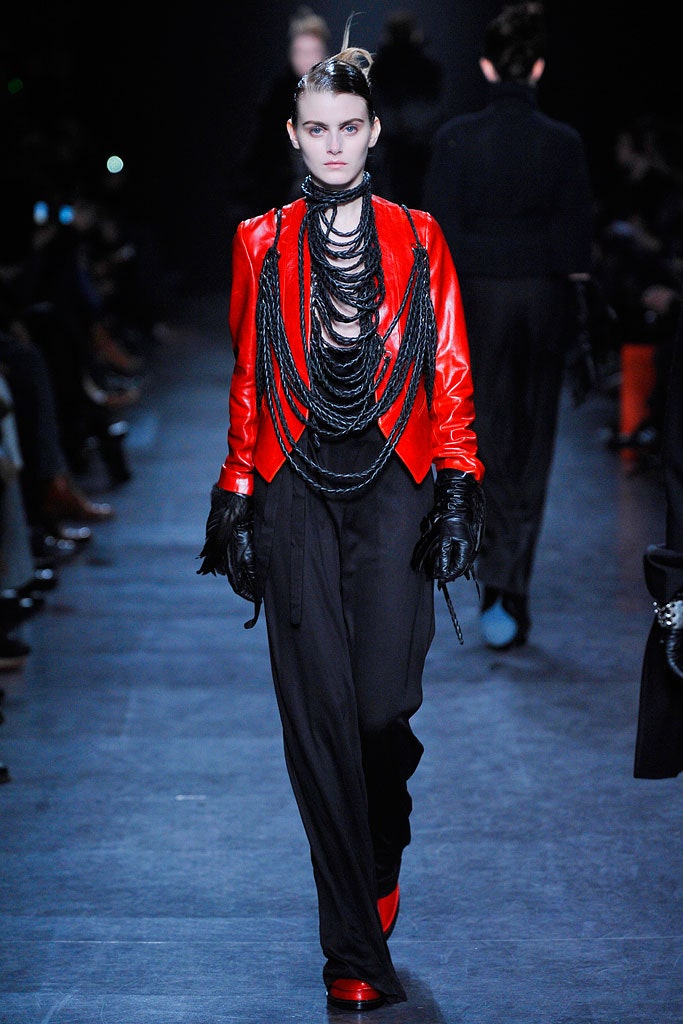 red leather fitted jacket with black pants