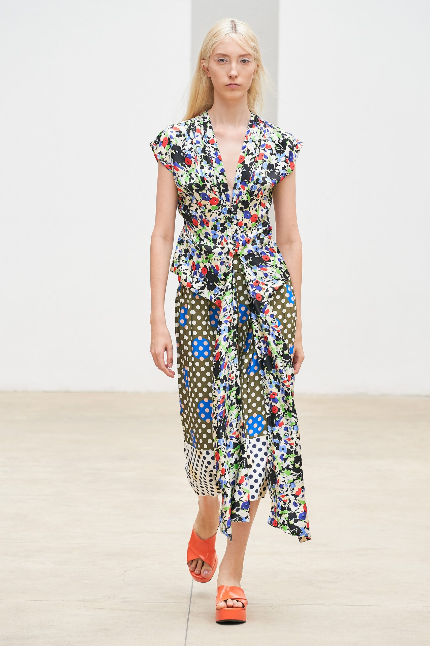 multi-patterned midi dress with orange shoes