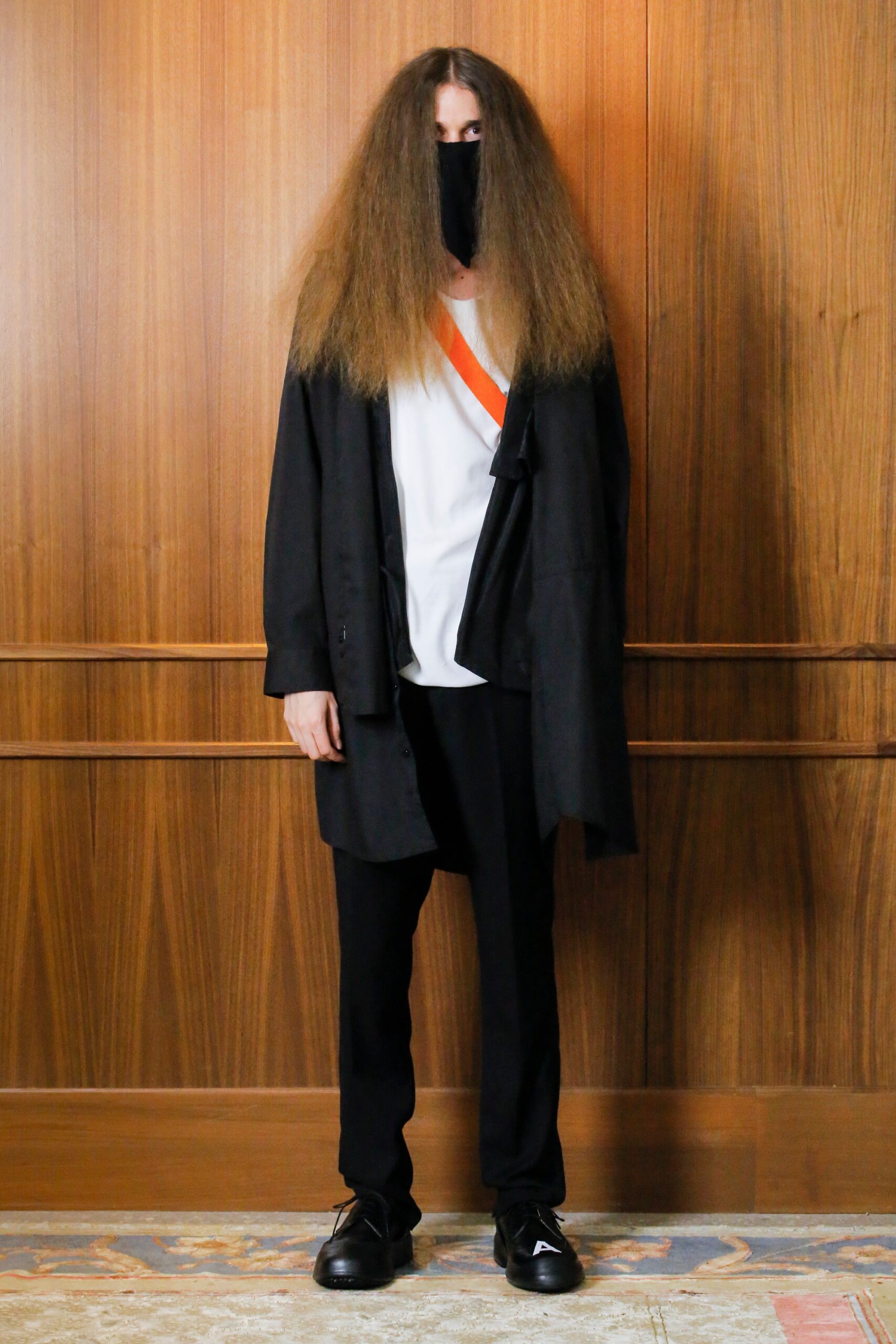 black relaxed jacket with white top