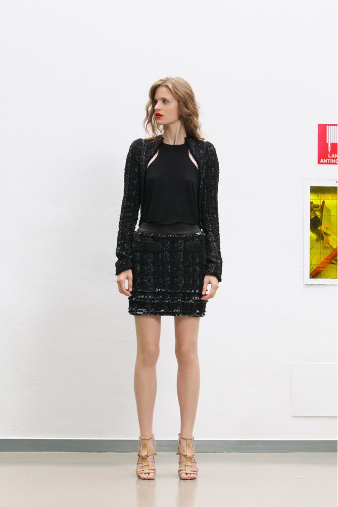 black fitted jacket and mini skirt