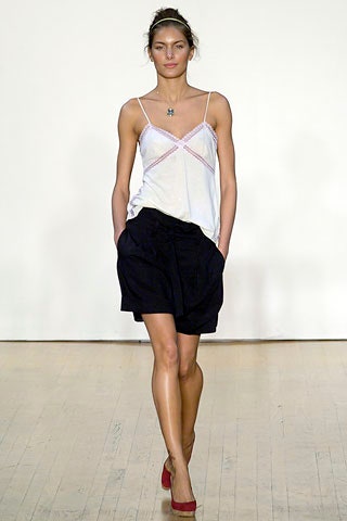 white silk top with black shorts