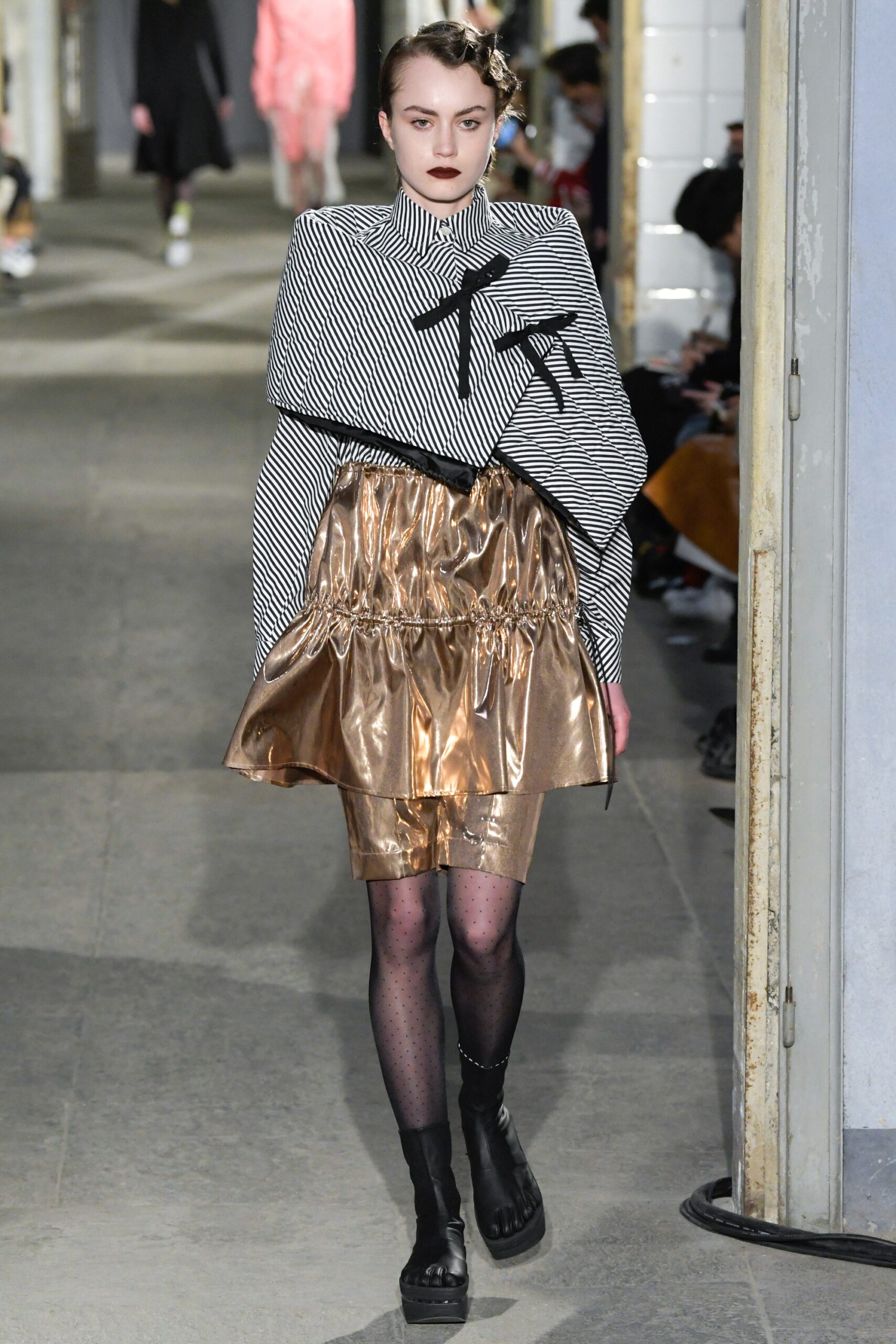 striped top with gold skirt