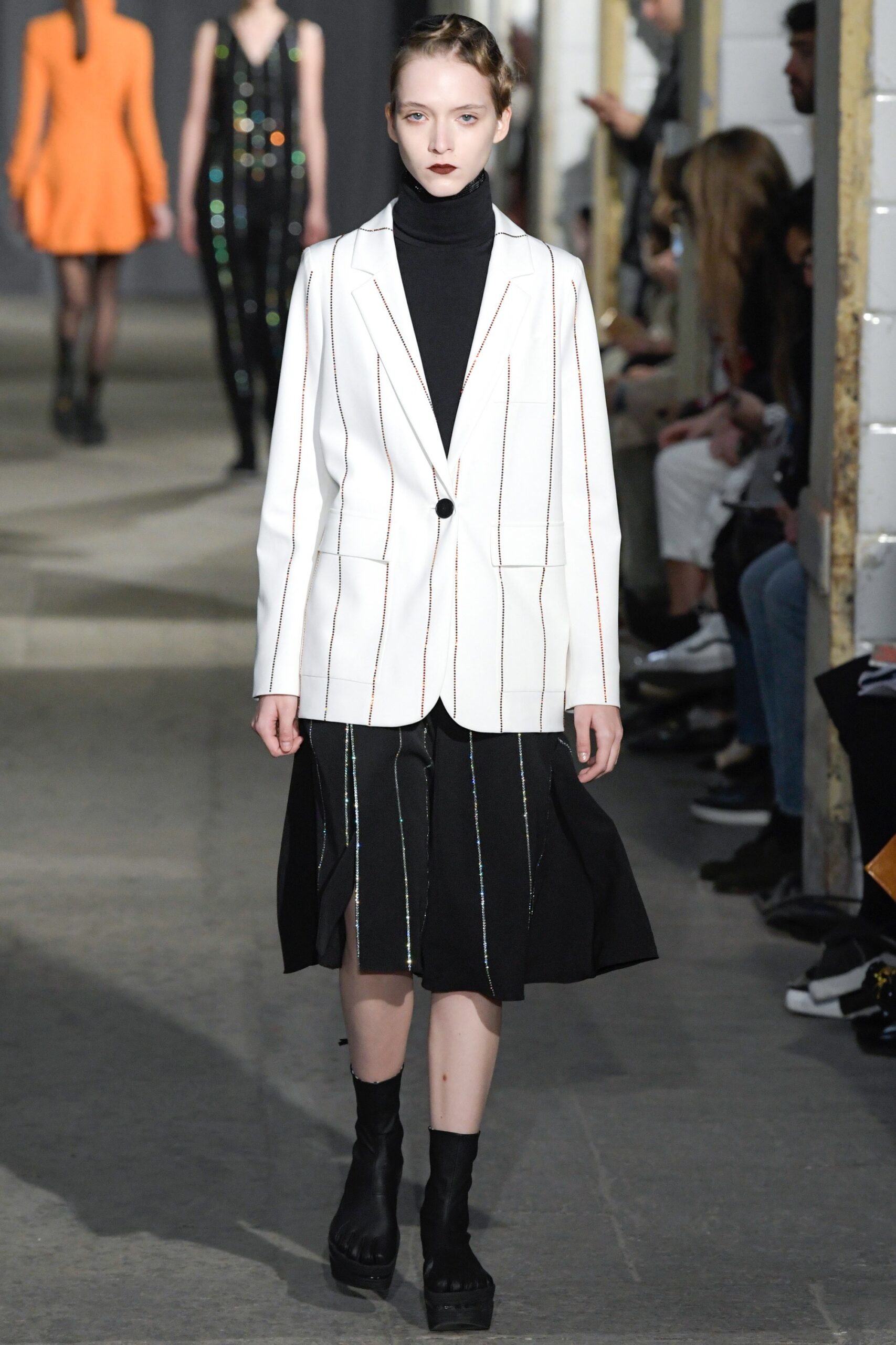tailored white blazer with black skirt