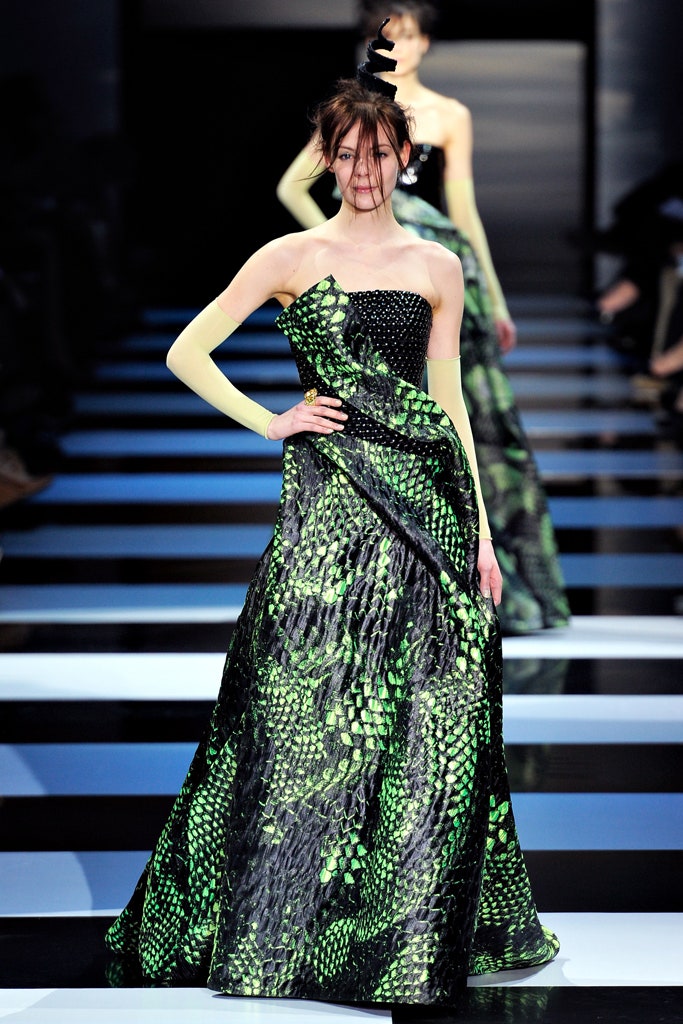 black and green draped gown with gloves