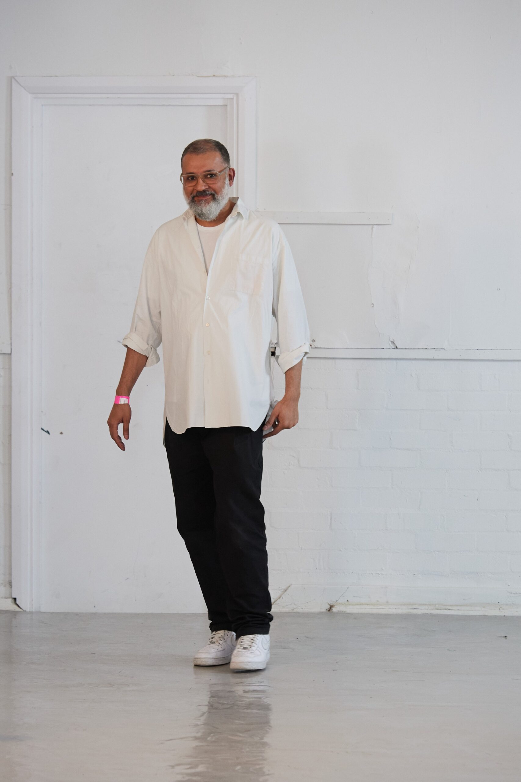 white relaxed shirt with black pants