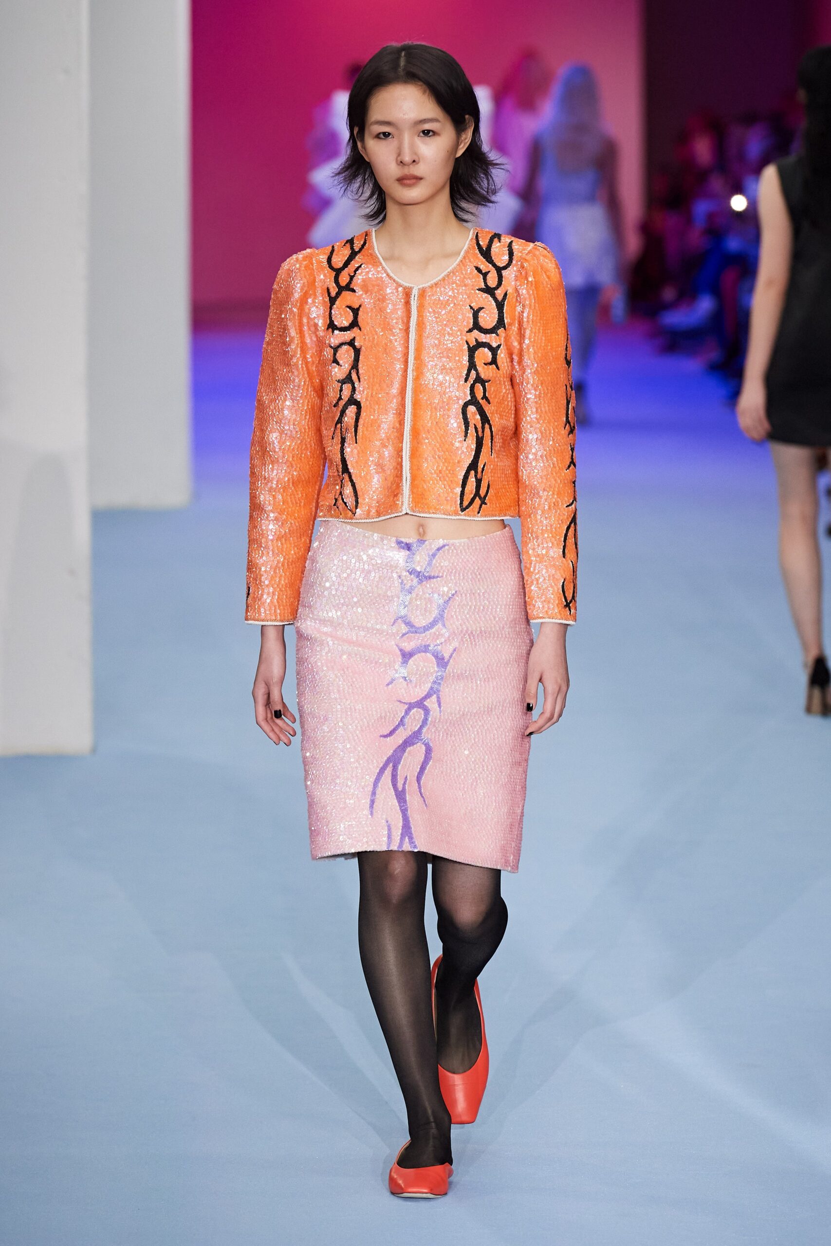 orange sequin jacket with pink skirt