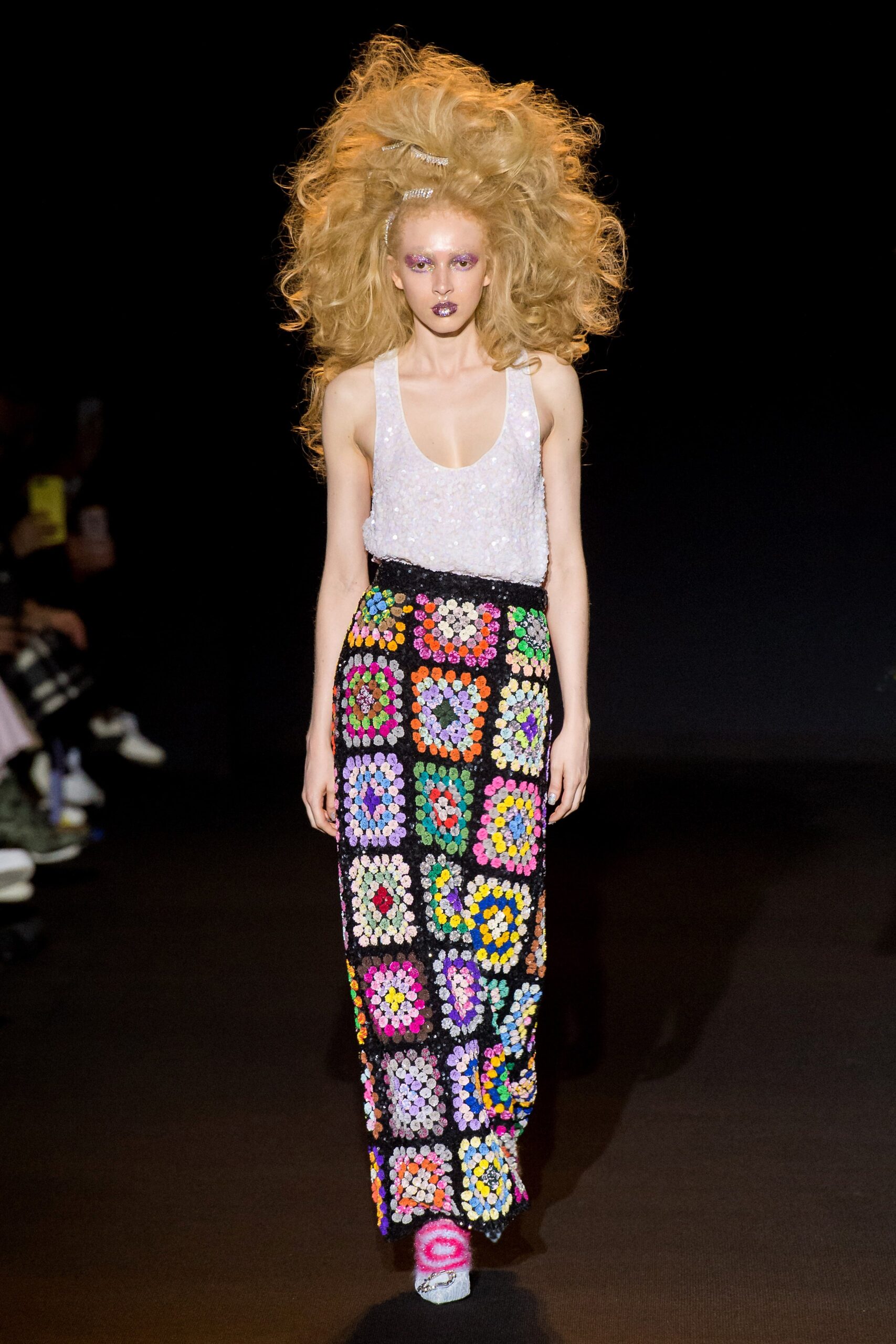 white embellished sleeveless top and multi-tiered skirt