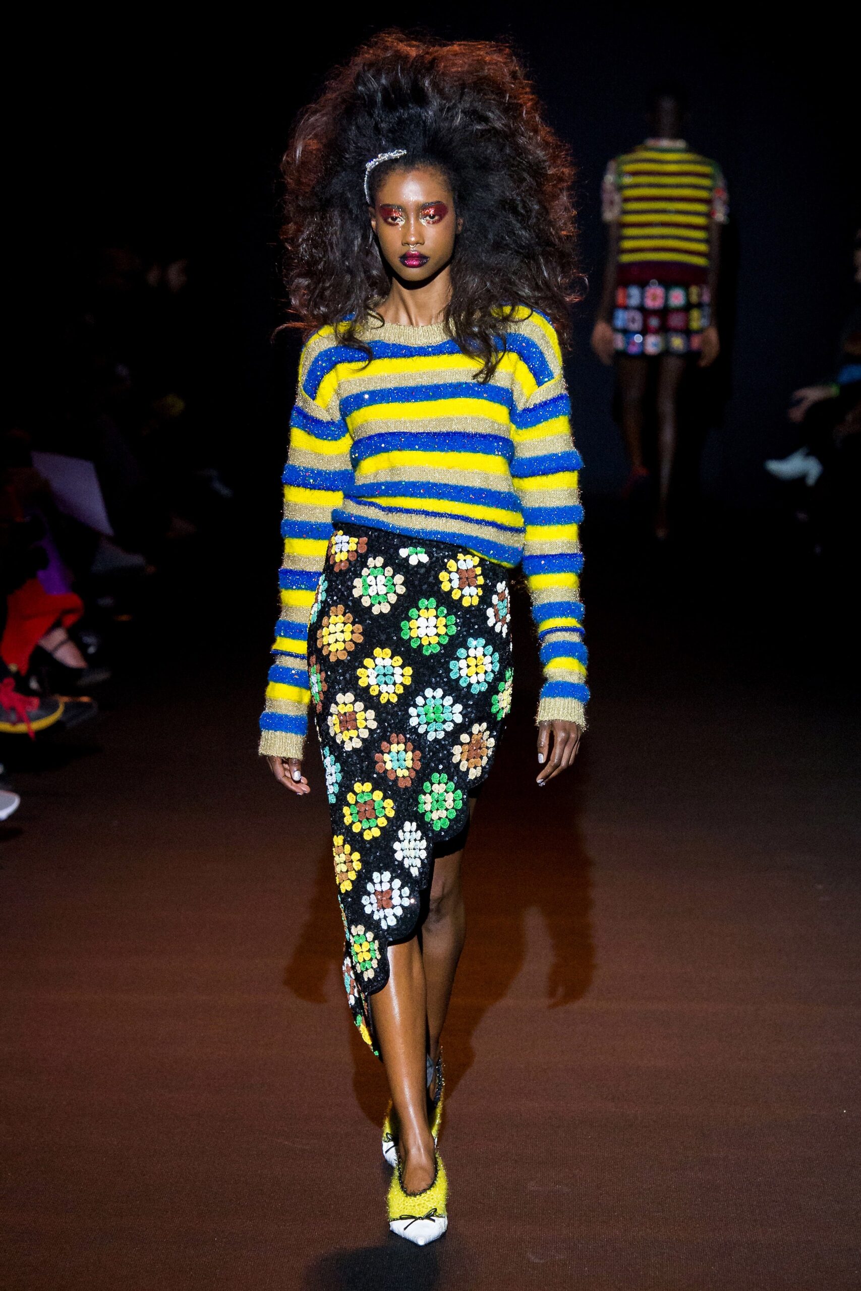 blue yellow striped sweater and black embroidered skirt