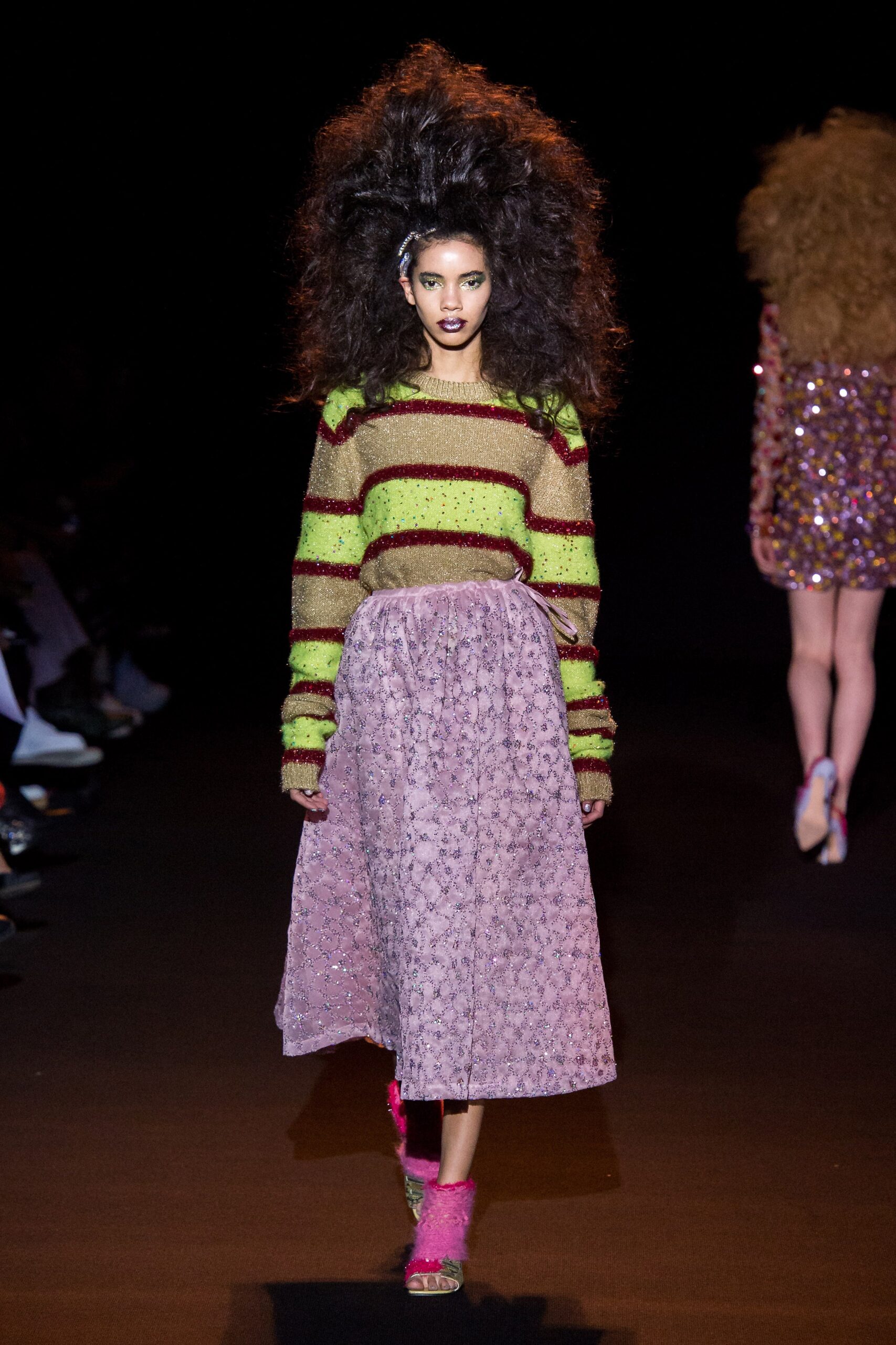 striped wool sweater and pleated pink skirt