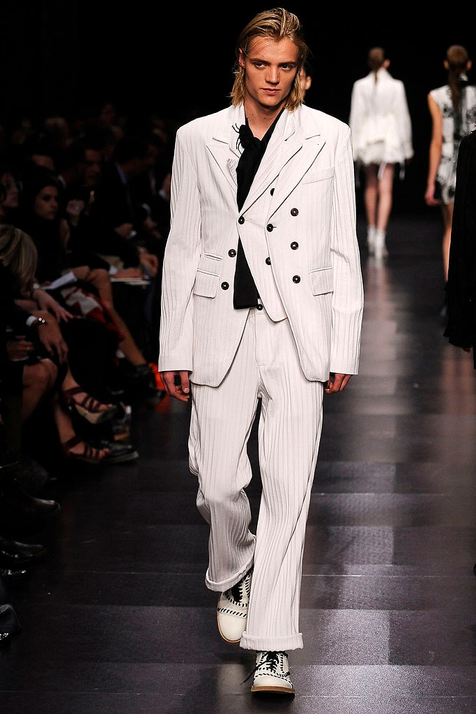 white tailored suit with black shoes