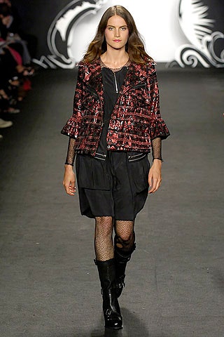 black and red fitted jacket with pleated skirt