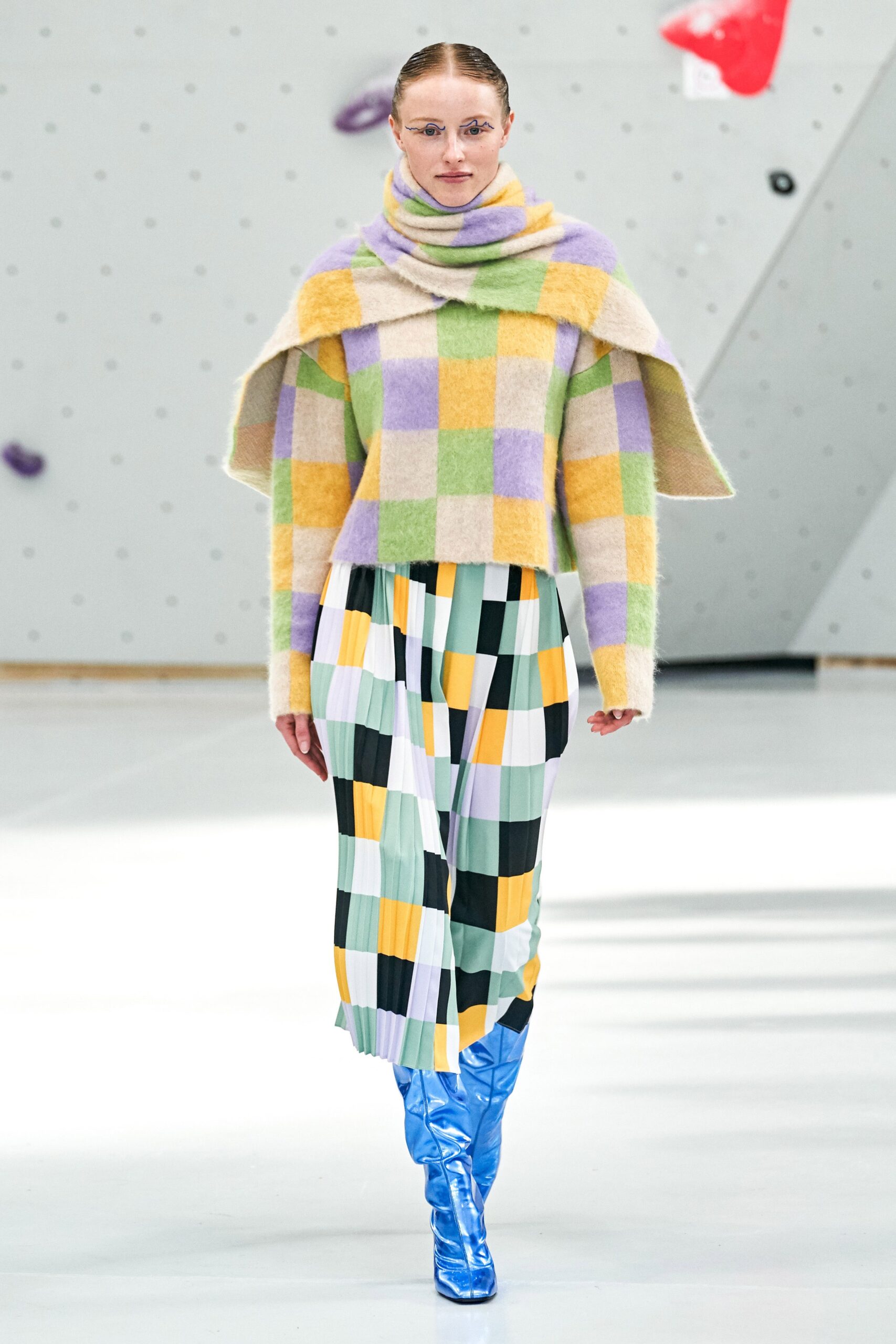 oversized checked sweater with pleated skirt