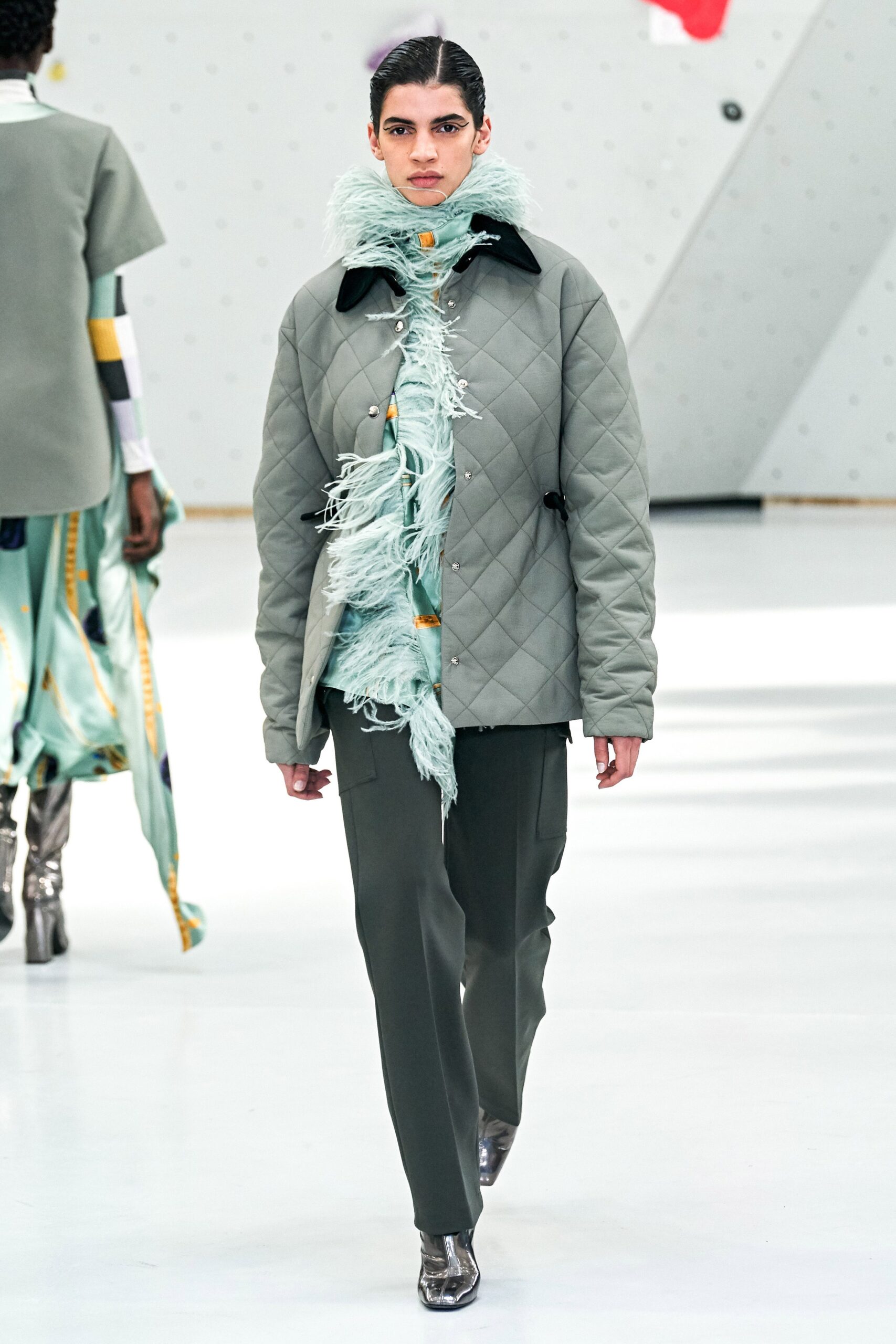 gray quilted jacket with green pants