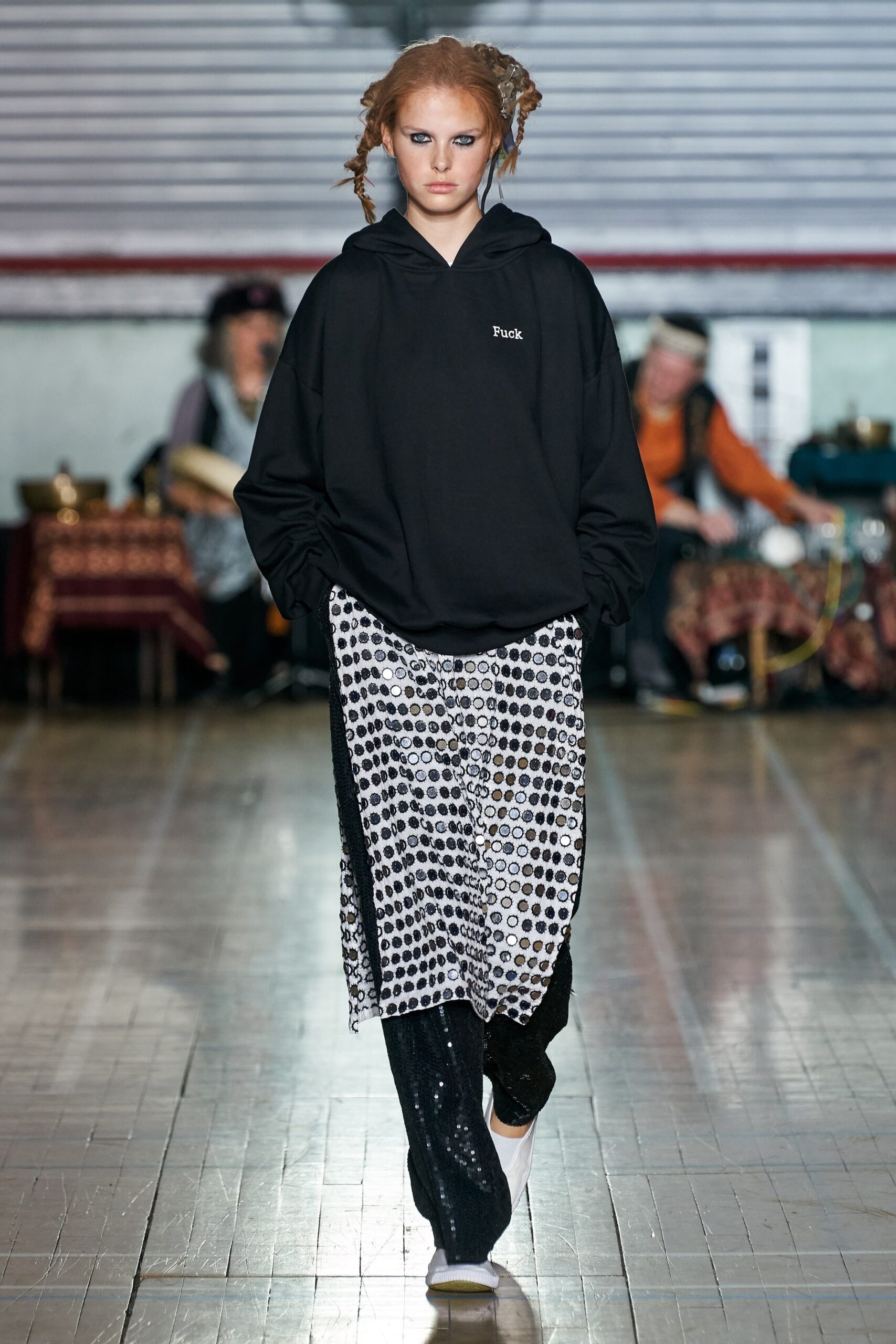 black oversized hoodie with polka-dot skirt