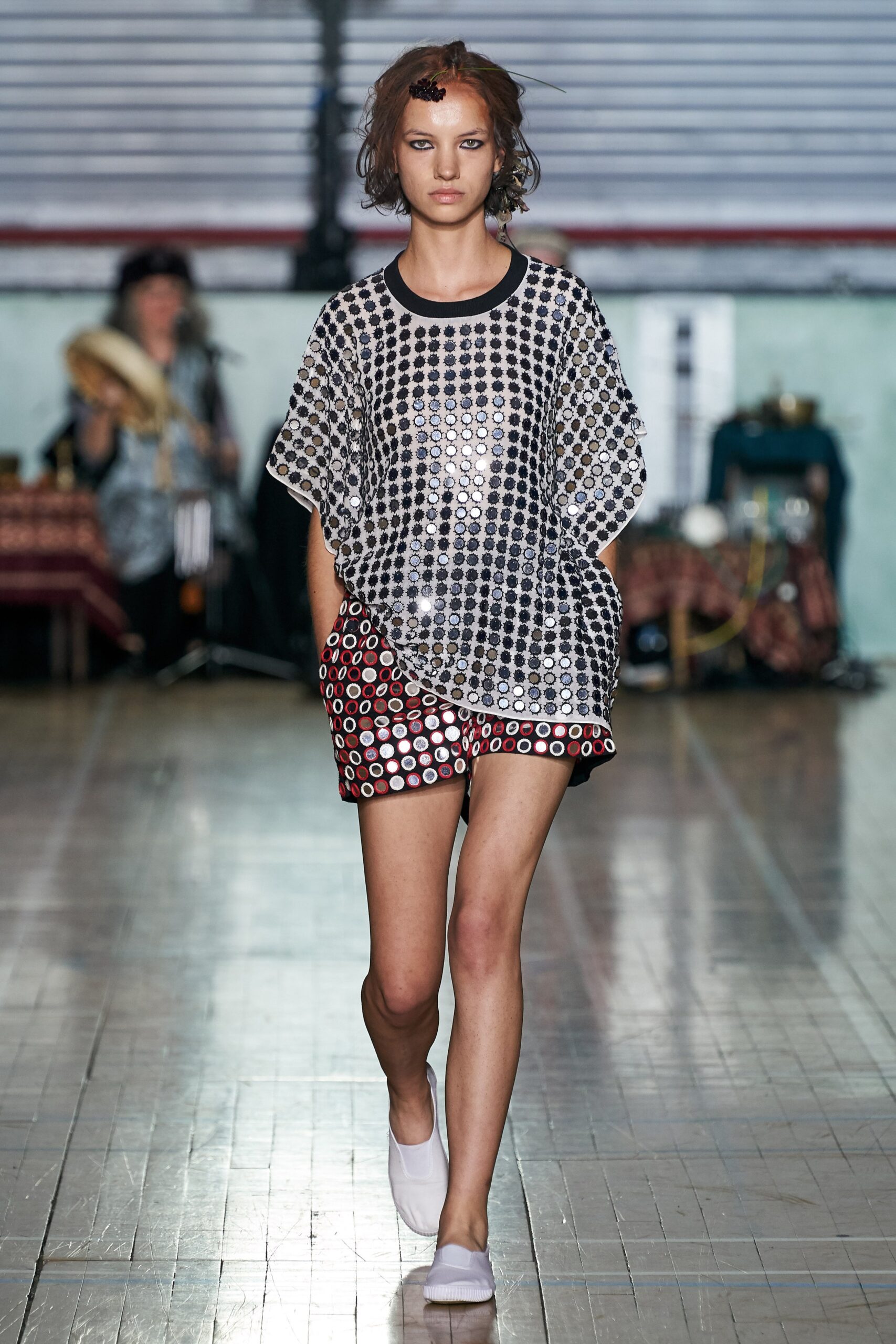 shiny silver top with red shorts