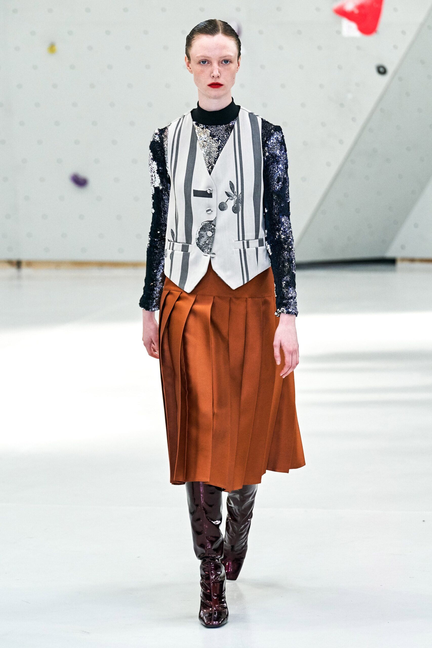 fitted vest and pleated midi skirt