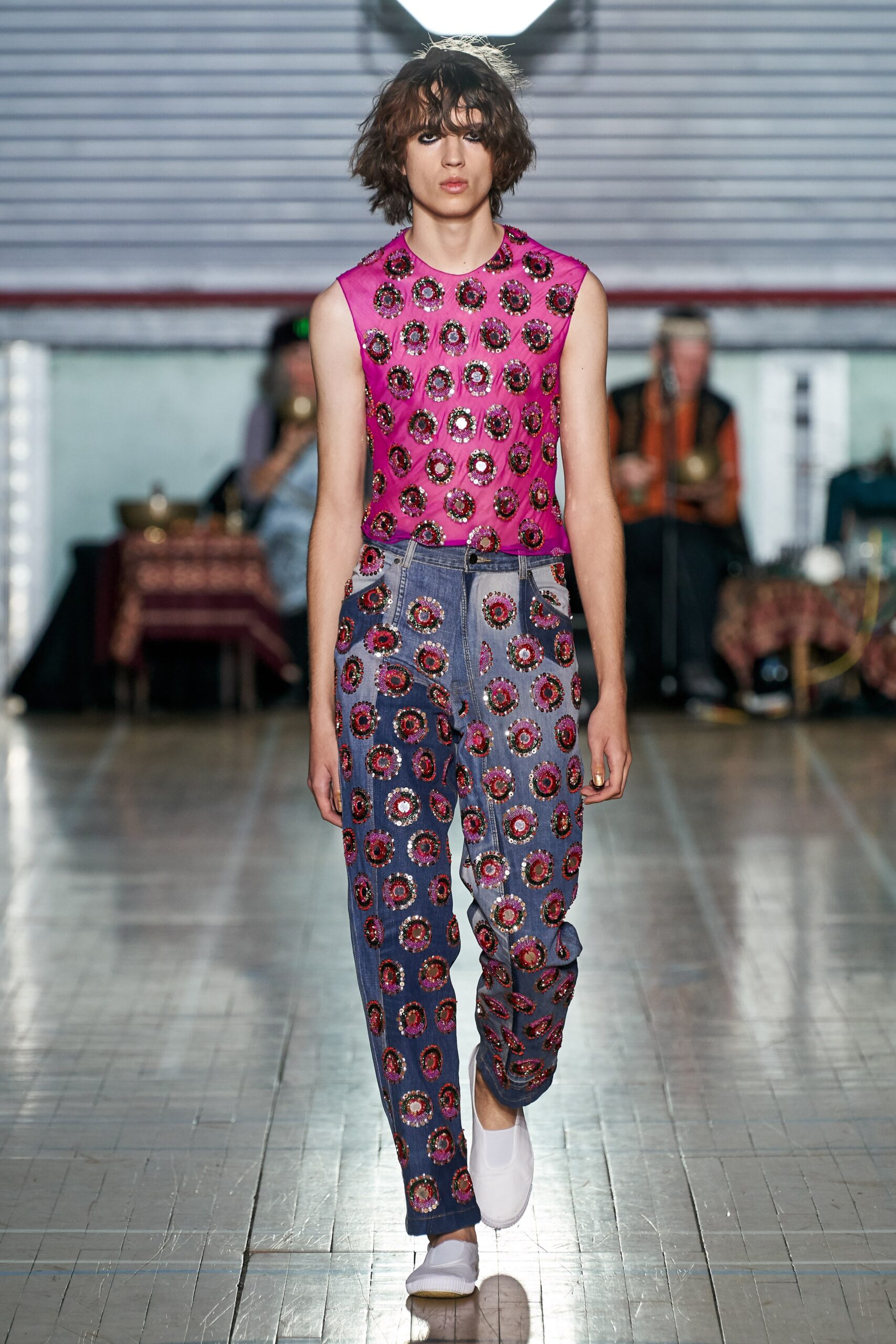 pink embroidered top with blue pants