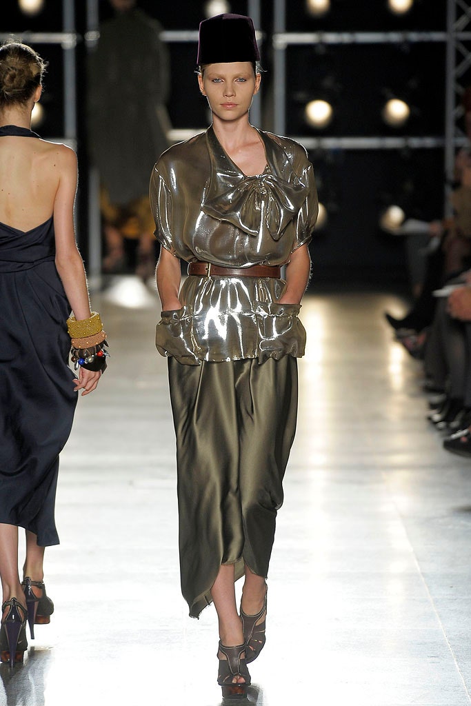 green vinyl high-neck fitted draped shiny top