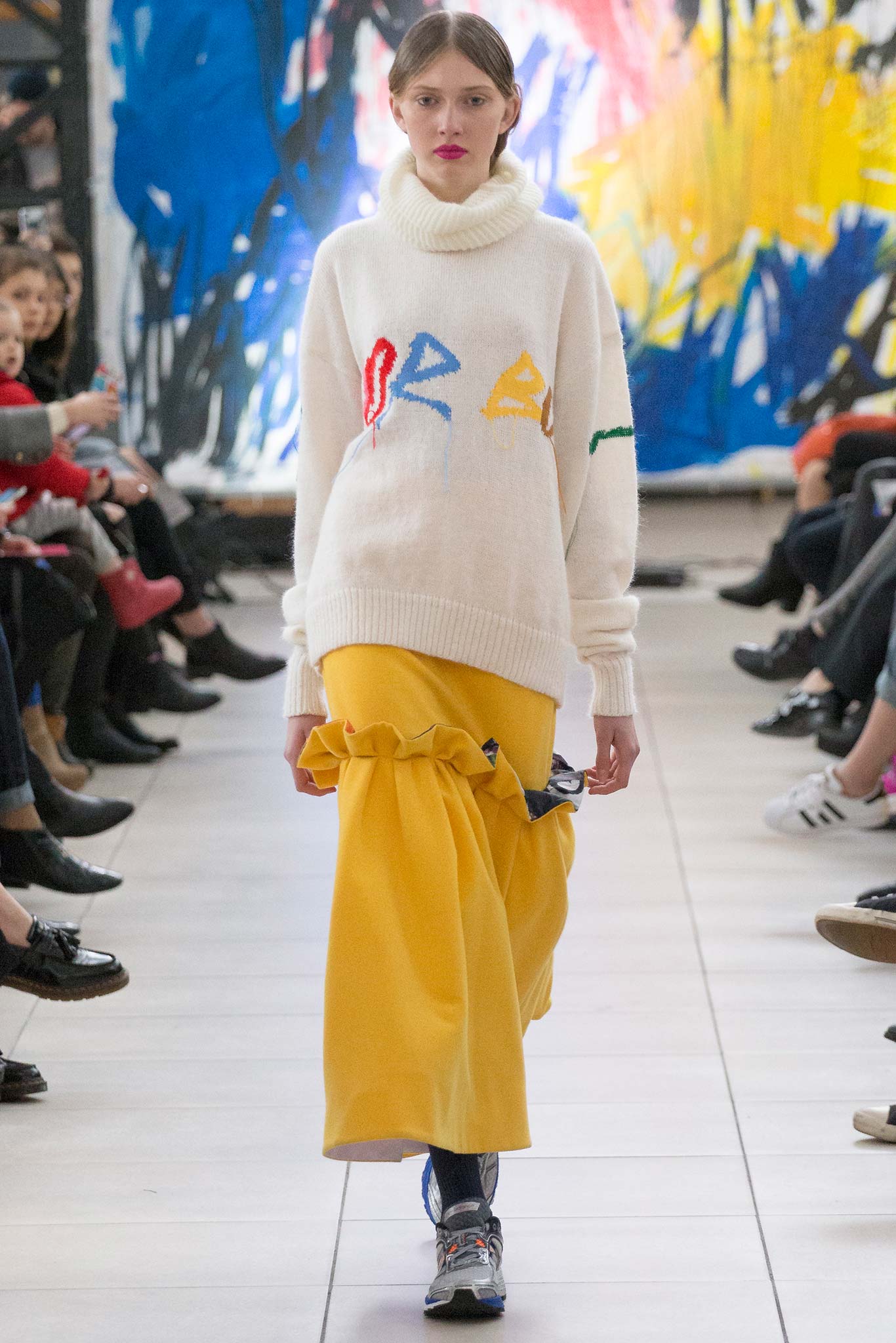 white oversized sweater and yellow skirt