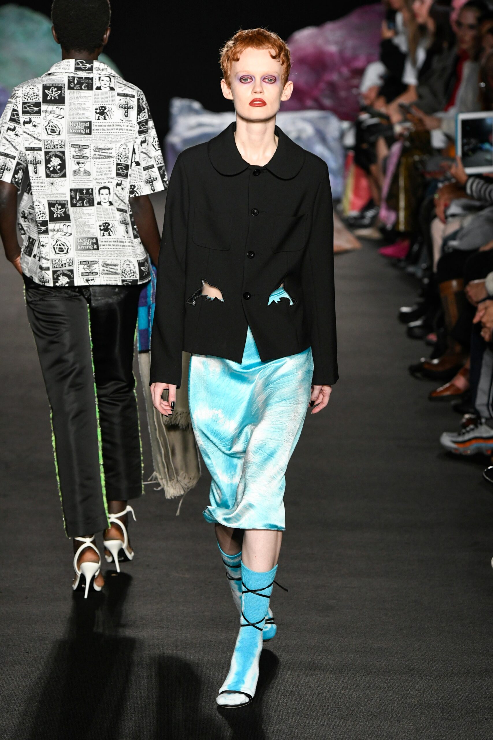 black tailored jacket with blue top and skirt