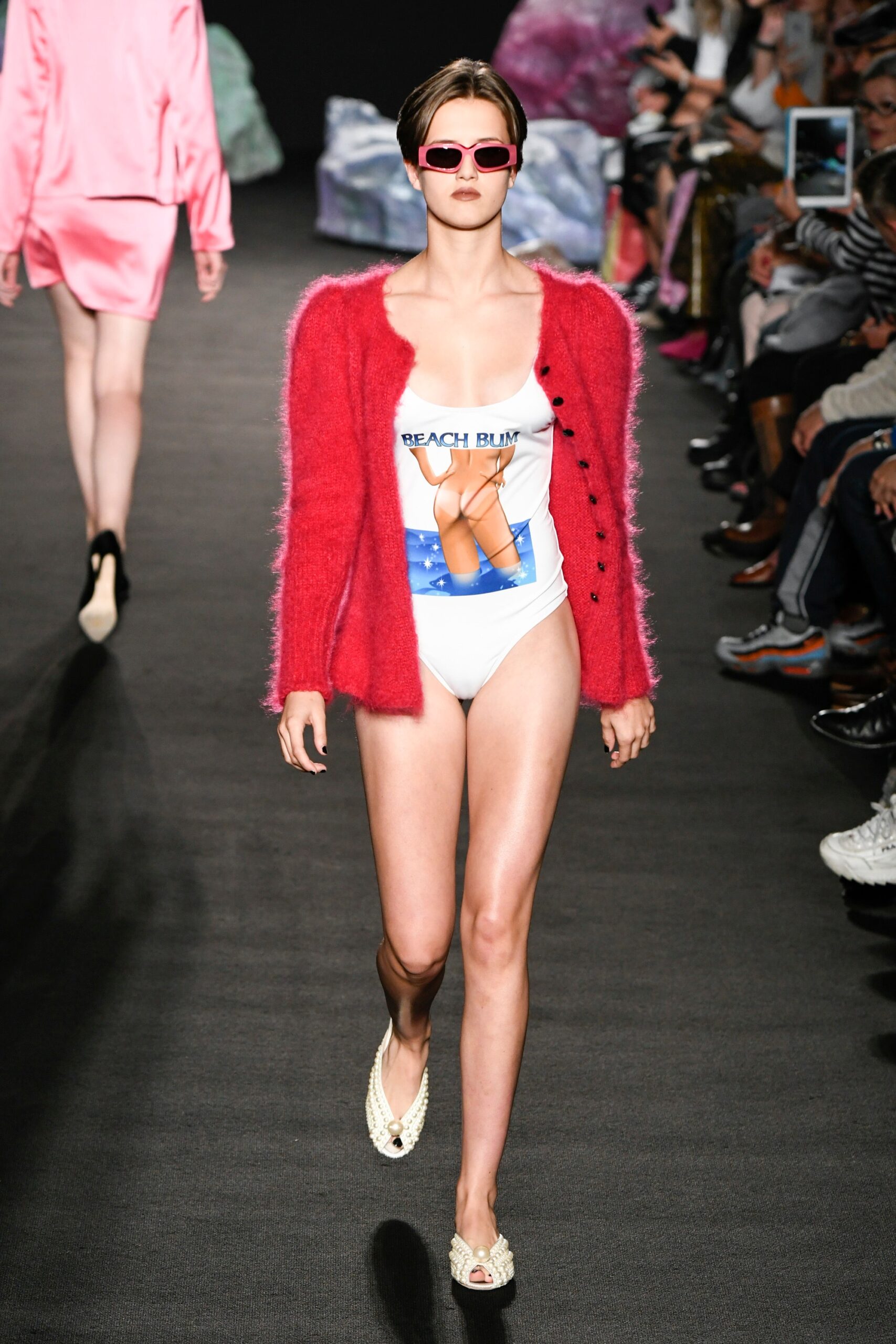 pink cardigan over white swimsuit