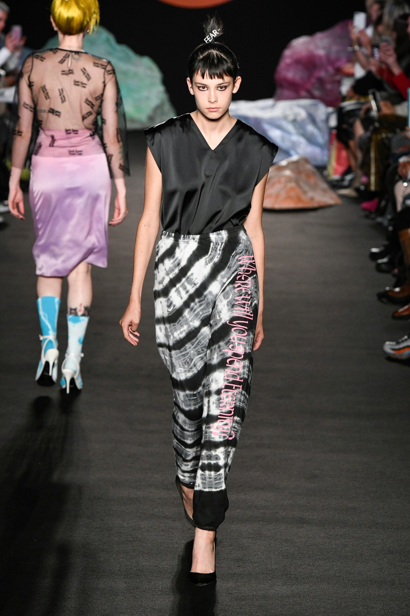 black silk fitted top with gray printed pants