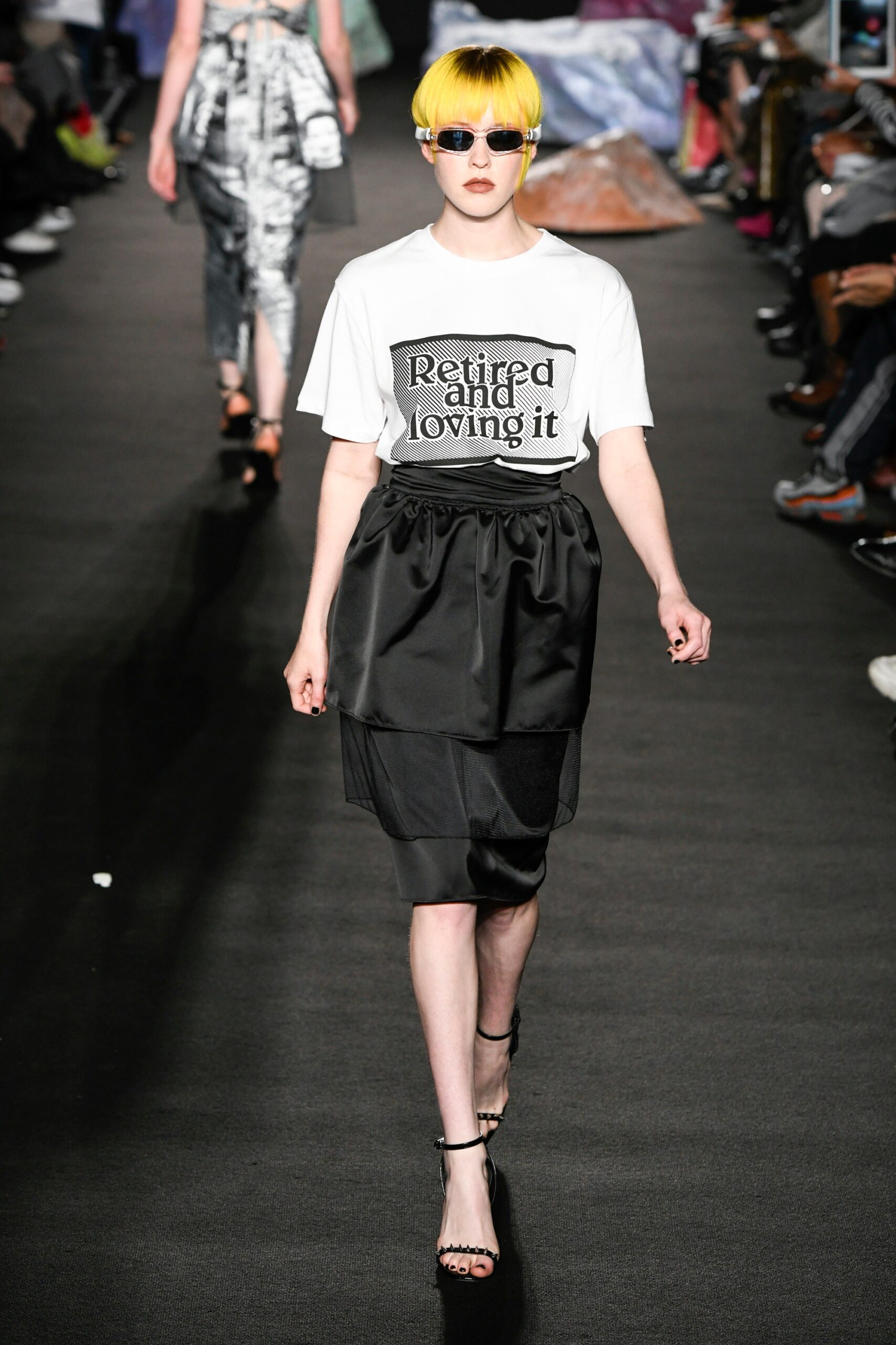 white printed top and black skirt
