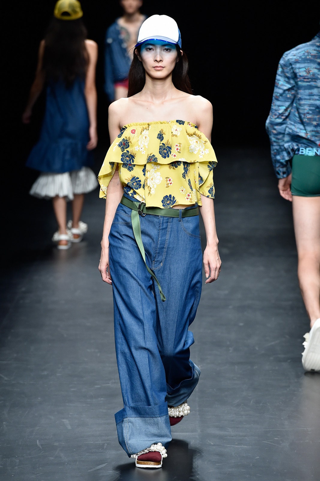 yellow off-shoulder ruffled top with blue denim pants