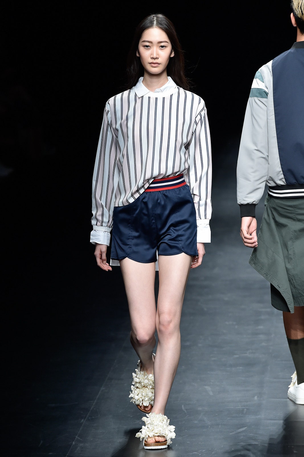 striped white shirt and navy shorts