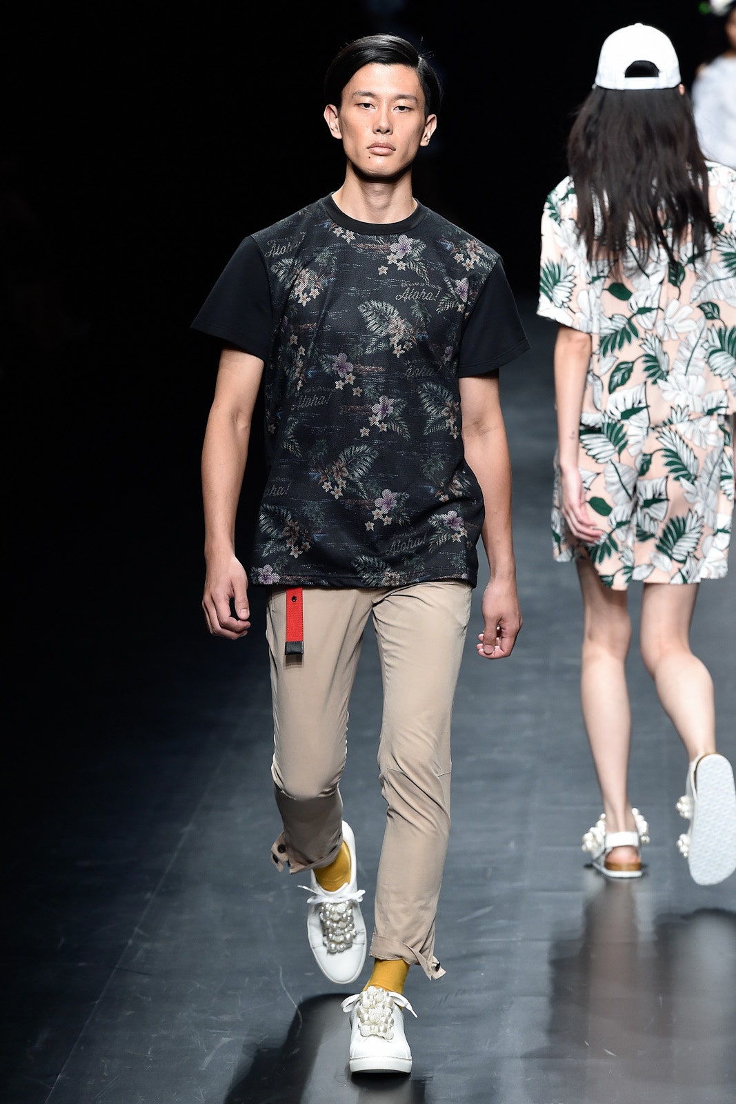 black printed t-shirt with beige pants