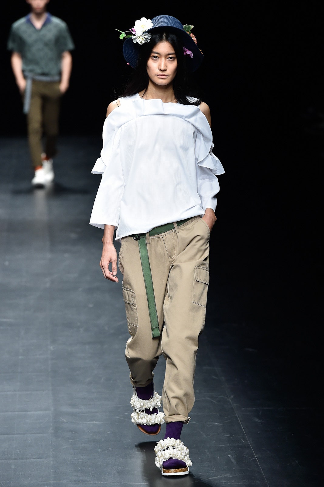 white off-shoulder blouse with cargo pants