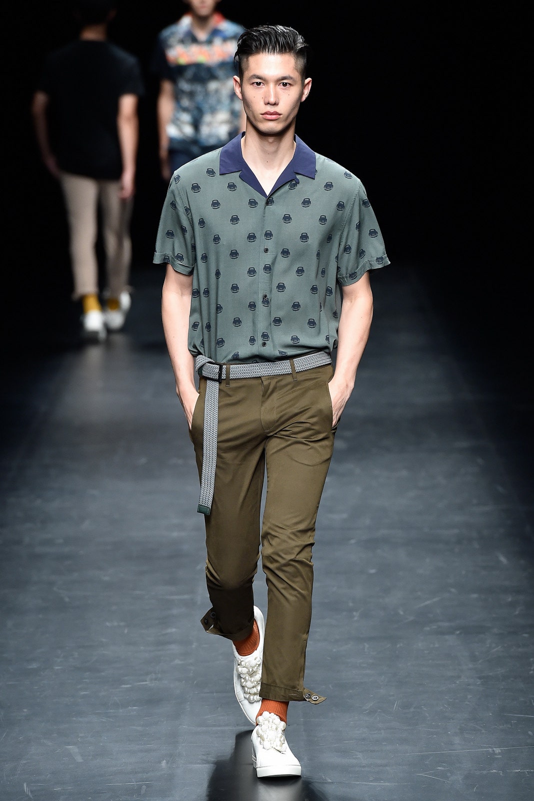 green printed shirt with brown pants