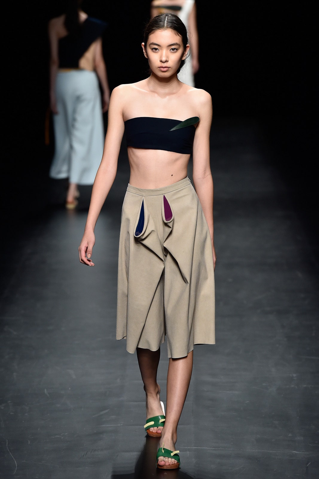 black strapless top beige pleated skirt