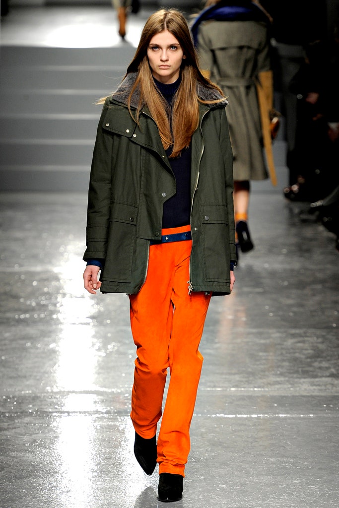 green jacket and orange pants