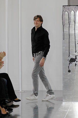black shirt gray pants white shoes