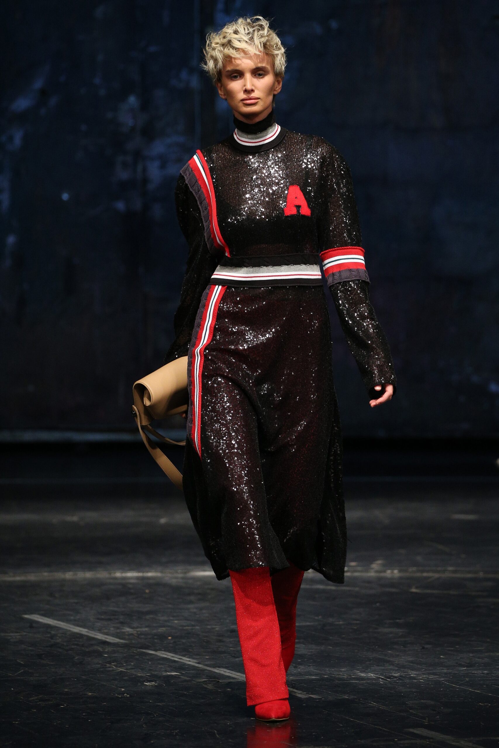 black sequin midi dress with red accents